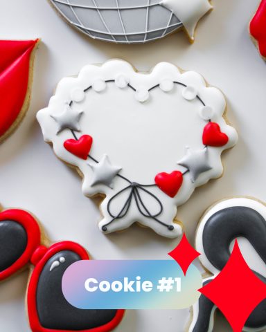 Decorated cookies shaped like hearts and a heart wreath with red and gray accents.